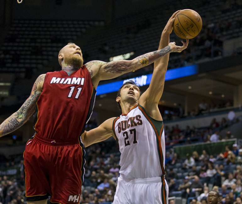 Mar 24, 2015; Milwaukee, WI, USA; Miami Heat forward Chris Andersen (11) and Milwaukee Bucks center Zaza Pachulia (27) reach for a rebound during the third quarter at BMO Harris Bradley Center. Mandatory Credit: Jeff Hanisch-USA TODAY Sports