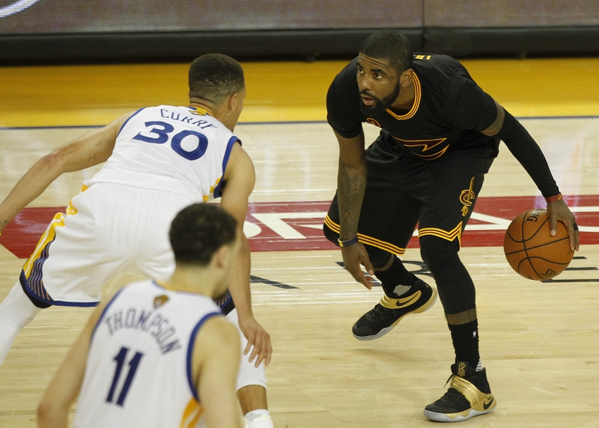 June 19, 2016; Oakland, CA, USA; Cleveland Cavaliers guard Kyrie Irving (2) moves the ball against Golden State Warriors guard Stephen Curry (30) in the second half in game seven of the NBA Finals at Oracle Arena. Mandatory Credit: Cary Edmondson-USA TODAY Sports