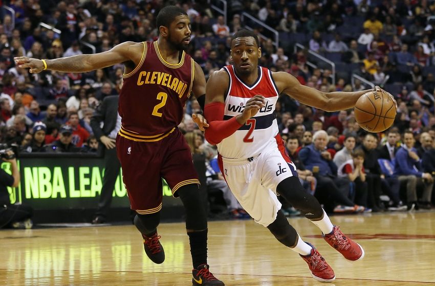Feb 20, 2015; Washington, DC, USA; Washington Wizards guard John Wall (2) dribbles the ball as Cleveland Cavaliers guard Kyrie Irving (2) defends in the first quarter at Verizon Center. Mandatory Credit: Geoff Burke-USA TODAY Sports