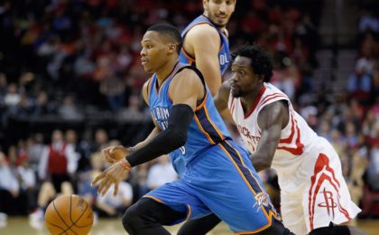 Nov 2, 2015; Houston, TX, USA;  Oklahoma City Thunder guard Russell Westbrook (0) dribbles against Houston Rockets guard Patrick Beverley (2) at Toyota Center. Rocket won 110 to 105. Mandatory Credit: Thomas B. Shea-USA TODAY Sports