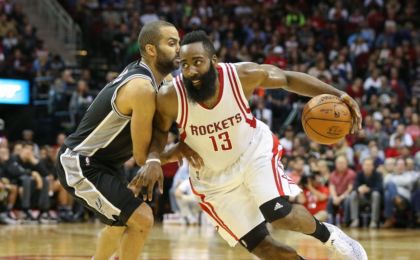 Feb 27, 2016; Houston, TX, USA; Houston Rockets guard James Harden (13) dribbles past San Antonio Spurs guard Tony Parker (9) during a game at Toyota Center. Mandatory Credit: Troy Taormina-USA TODAY Sports