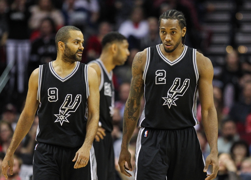Feb 27, 2016; Houston, TX, USA; San Antonio Spurs guard Tony Parker (9) and forward Kawhi Leonard (2) after a play during the game against the Houston Rockets at Toyota Center. Mandatory Credit: Troy Taormina-USA TODAY Sports