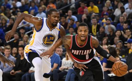 October 21, 2016; Oakland, CA, USA; Portland Trail Blazers guard Damian Lillard (0) dribbles the ball against Golden State Warriors forward Kevin Durant (35) during the first quarter at Oracle Arena. Mandatory Credit: Kyle Terada-USA TODAY Sports