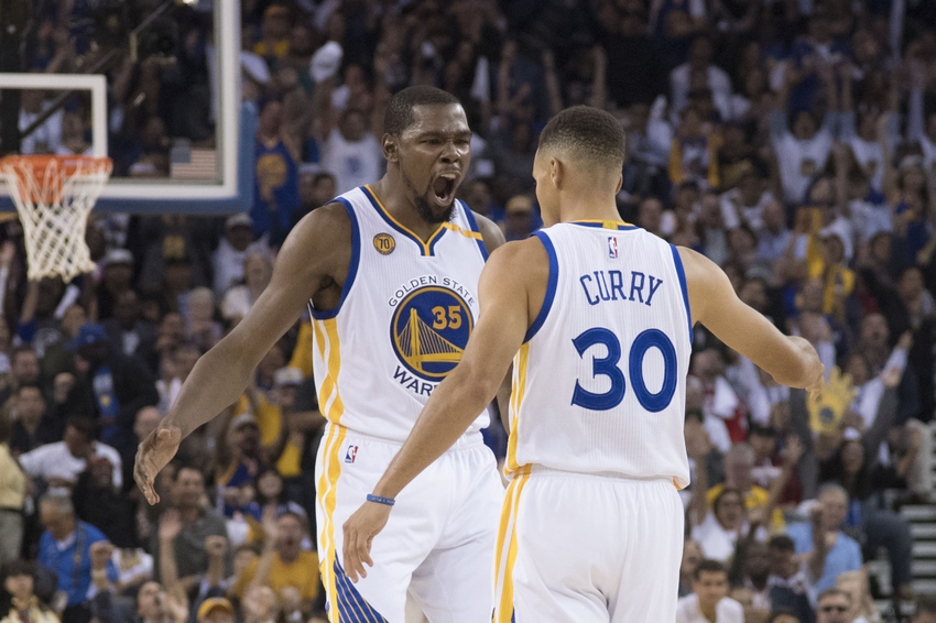 October 25, 2016; Oakland, CA, USA; Golden State Warriors forward Kevin Durant (35) celebrates with guard Stephen Curry (30) against the San Antonio Spurs during the second quarter at Oracle Arena. Mandatory Credit: Kyle Terada-USA TODAY Sports