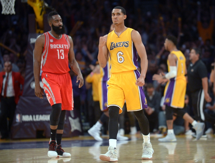 October 26, 2016; Los Angeles, CA, USA; Los Angeles Lakers guard Jordan Clarkson (6) celebrates the 120-114 victroy as Houston Rockets guard James Harden (13) walks off the court following the second half at Staples Center. Mandatory Credit: Gary A. Vasquez-USA TODAY Sports