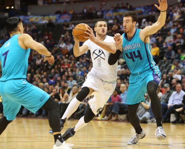 Jan 10, 2016; Denver, CO, USA; Denver Nuggets forward Danilo Gallinari (8) drives to the basket against Charlotte Hornets center Frank Kaminsky III (44) during the first half at Pepsi Center. Mandatory Credit: Chris Humphreys-USA TODAY Sports