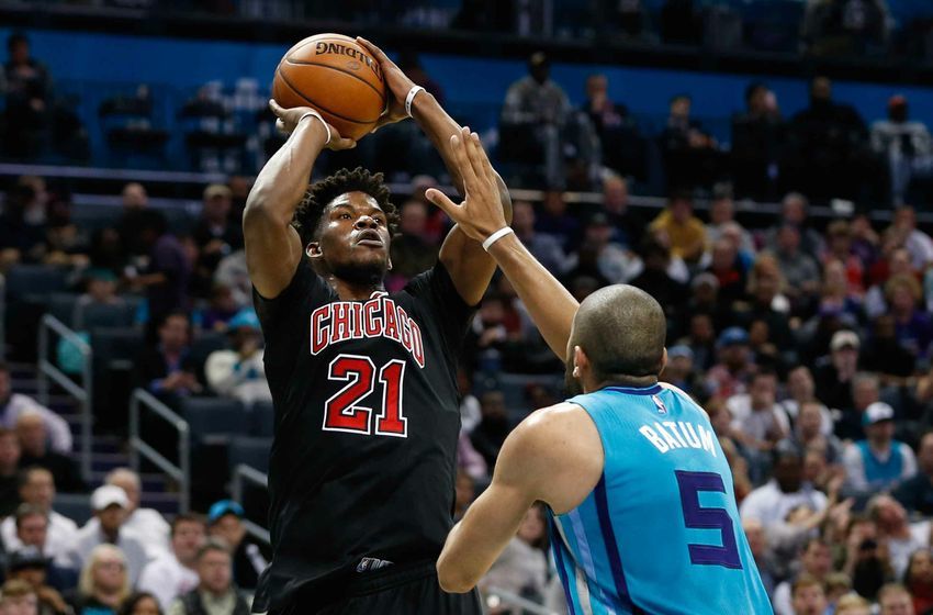 Dec 23, 2016; Charlotte, NC, USA; Chicago Bulls forward Jimmy Butler (21) shoots the ball over Charlotte Hornets guard Nicolas Batum (5) in the second half at Spectrum Center. The Hornets defeated the Bulls 103-91. Mandatory Credit: Jeremy Brevard-USA TODAY Sports