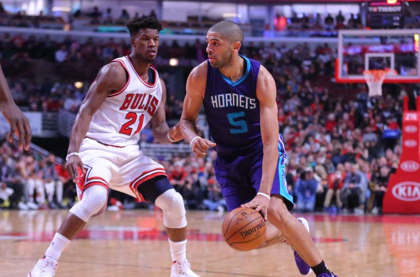 Jan 2, 2017; Chicago, IL, USA; Charlotte Hornets guard Nicolas Batum (5) drives around Chicago Bulls forward Jimmy Butler (21) during the first half at the United Center. Mandatory Credit: Dennis Wierzbicki-USA TODAY Sports