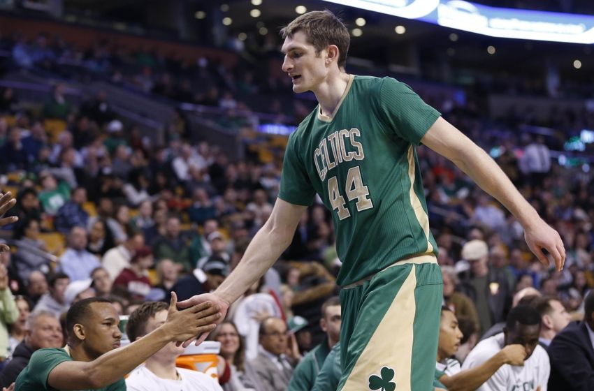 Mar 16, 2015; Boston, MA, USA; Boston Celtics guard Avery Bradley (0) welcomes forward center Tyler Zeller (44) to the bench during the fourth quarter against the Philadelphia 76ers at TD Garden. The Boston Celtics won 108-89. Mandatory Credit: Greg M. Cooper-USA TODAY Sports