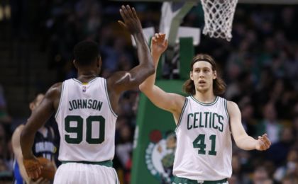 Mar 21, 2016; Boston, MA, USA; Boston Celtics center Kelly Olynyk (41) is congratulated by forward Amir Johnson (90) after a basket during the second quarter against the Orlando Magic at TD Garden. Mandatory Credit: Greg M. Cooper-USA TODAY Sports