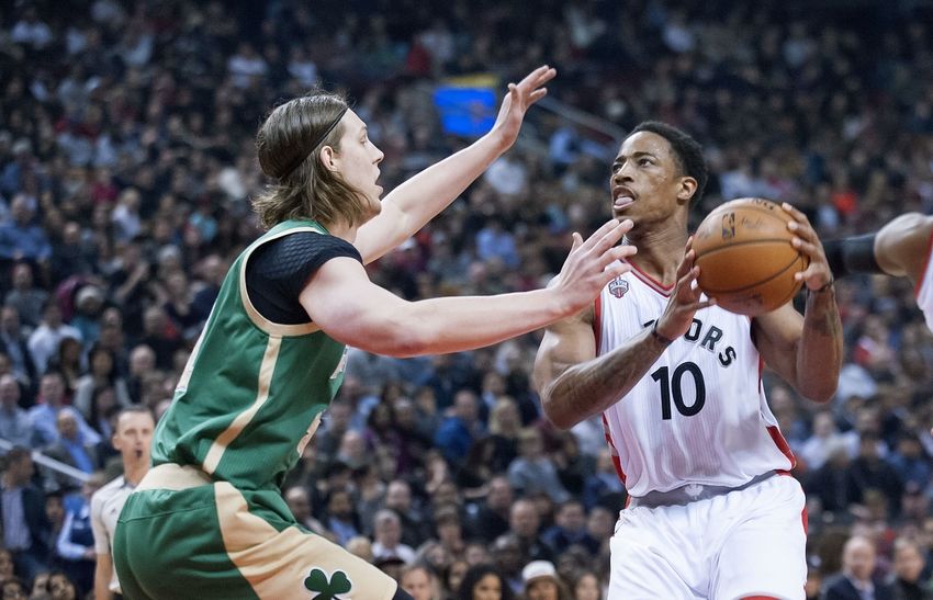 Mar 18, 2016; Toronto, Ontario, CAN; Toronto Raptors guard DeMar DeRozan (10) looks to shoot as Boston Celtics forward Kelly Olynyk (41) defends in the first quarter at Air Canada Centre. Mandatory Credit: Peter Llewellyn-USA TODAY Sports
