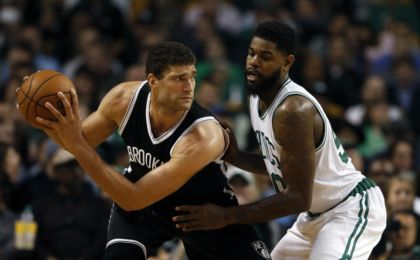 Nov 20, 2015; Boston, MA, USA; Brooklyn Nets center Brook Lopez (11) works the ball against Boston Celtics forward Amir Johnson (90) during the second half at TD Garden. The Celtics defeated the Nets 120-95. Mandatory Credit: David Butler II-USA TODAY Sports