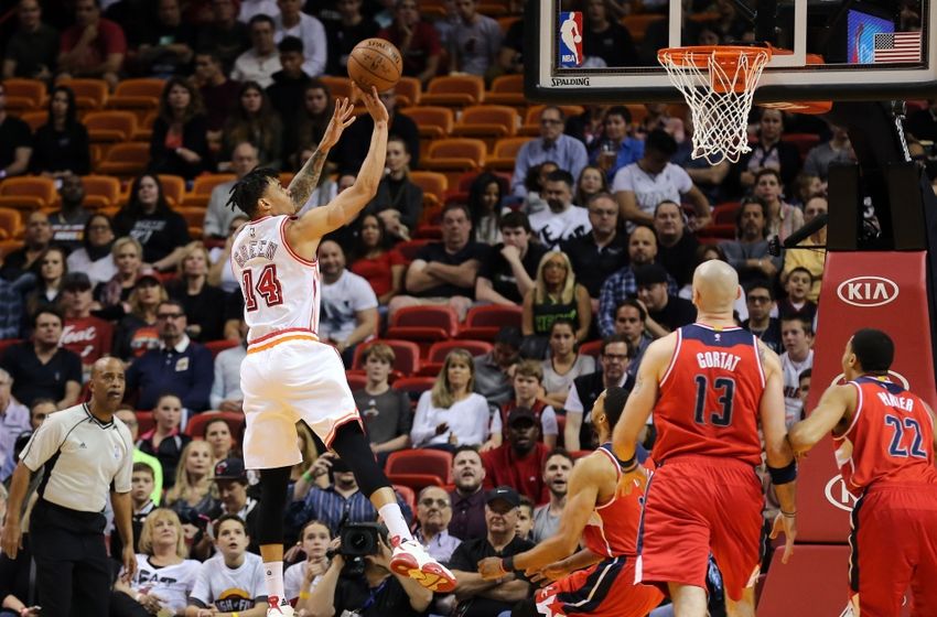 Feb 20, 2016; Miami, FL, USA; Miami Heat forward Gerald Green (14) shoots the ball as Washington Wizards center Marcin Gortat (13) looks on during the first half at American Airlines Arena. Mandatory Credit: Steve Mitchell-USA TODAY Sports