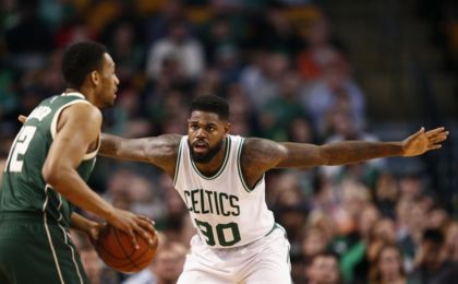 Feb 25, 2016; Boston, MA, USA; Boston Celtics forward Amir Johnson (90) defends against Milwaukee Bucks forward Jabari Parker (12) during the second half at TD Garden. Mandatory Credit: Mark L. Baer-USA TODAY Sports