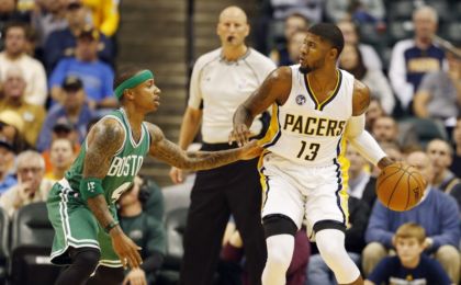 Nov 4, 2015; Indianapolis, IN, USA; Indiana Pacers forward Paul George (13) is guarded by Boston Celtics guard Isaiah Thomas (4) at Bankers Life Fieldhouse. Mandatory Credit: Brian Spurlock-USA TODAY Sports