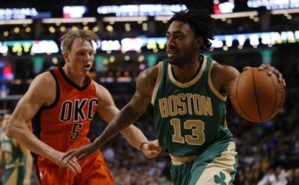Mar 16, 2016; Boston, MA, USA; Boston Celtics guard James Young (13) drives the ball against Oklahoma City Thunder forward Kyle Singler (5) in the second half at TD Garden. Oklahoma City Thunder defeated the Celtics 130-109. Mandatory Credit: David Butler II-USA TODAY Sports