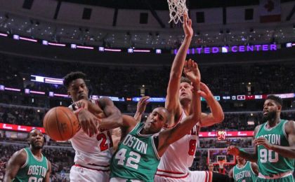 Oct 27, 2016; Chicago, IL, USA; Chicago Bulls guard Jimmy Butler (left) and center Robin Lopez (right) fight for a rebound against Boston Celtics center Al Horford (center) during the first half at the United Center. Mandatory Credit: Dennis Wierzbicki-USA TODAY Sports