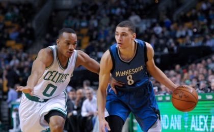 Dec 19, 2014; Boston, MA, USA; Minnesota Timberwolves guard Zach LaVine (8) controls the ball while being defended by Boston Celtics guard Avery Bradley (0) during the first half at TD Garden. Mandatory Credit: Bob DeChiara-USA TODAY Sports
