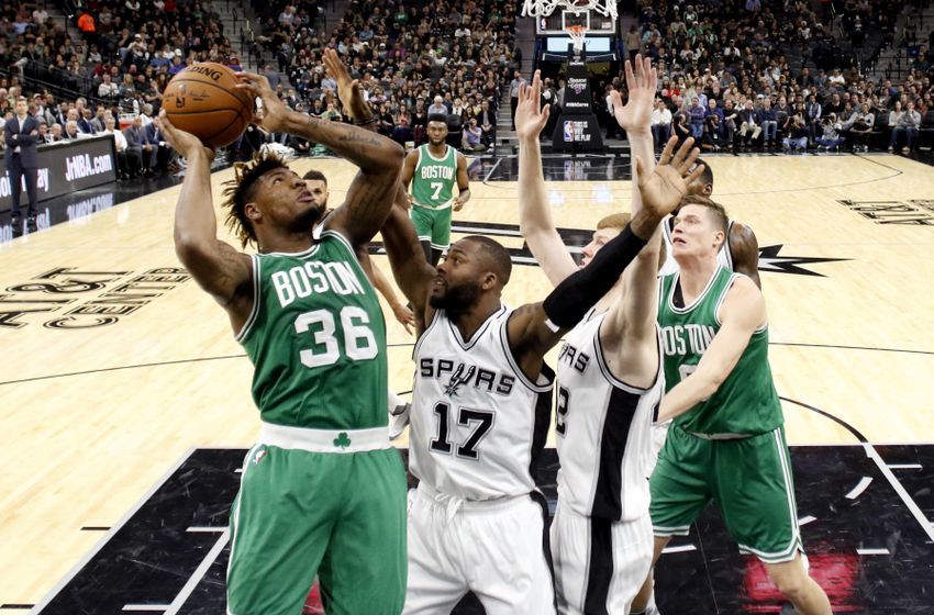 Dec 14, 2016; San Antonio, TX, USA; Boston Celtics point guard Marcus Smart (36) shoots the ball as San Antonio Spurs shooting guard Jonathon Simmons (17) defends during the first half at AT&T Center. Mandatory Credit: Soobum Im-USA TODAY Sports