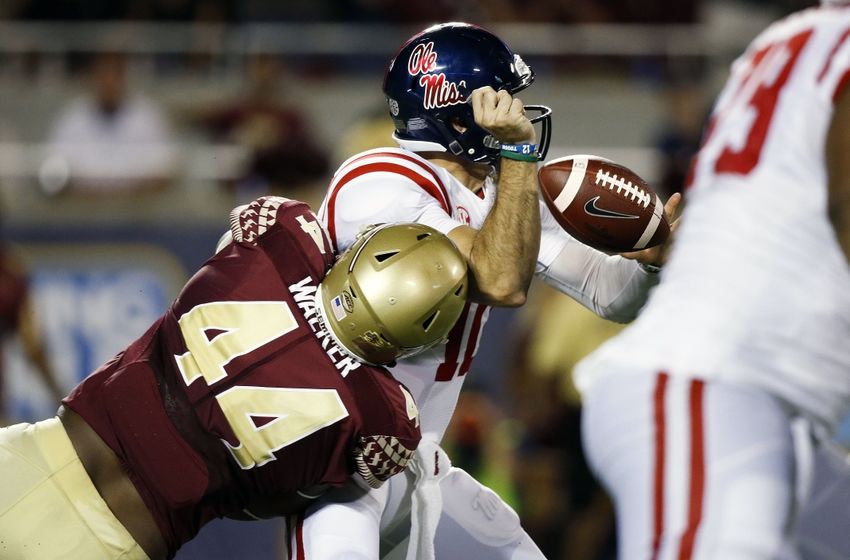 Sep 5, 2016; Orlando, FL, USA; Mississippi Rebels quarterback Chad Kelly (10) fumbles the ball after being hit by Florida State Seminoles defensive end DeMarcus Walker (44) in the third quarter at Camping World Stadium. Mandatory Credit: Logan Bowles-USA TODAY Sports