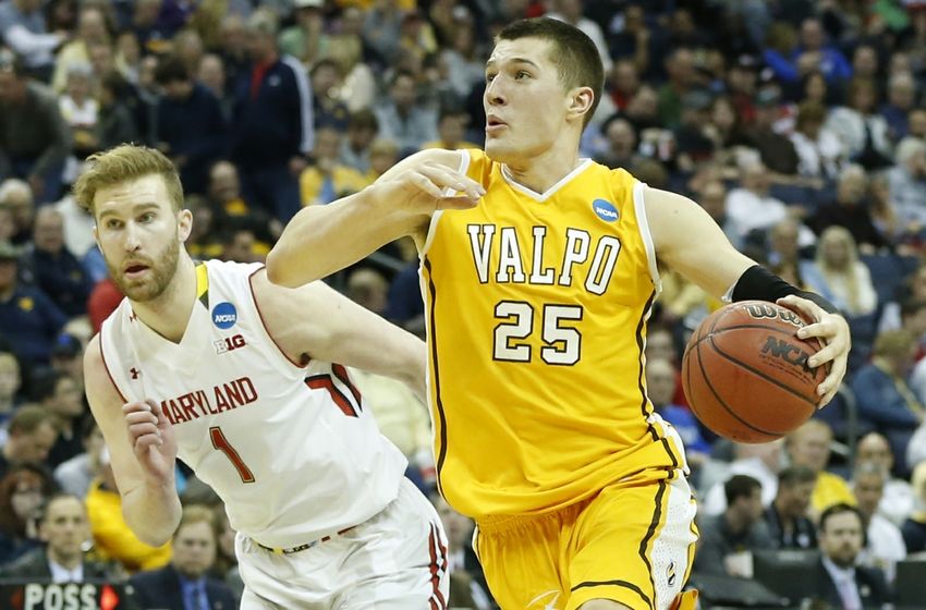 Mar 20, 2015; Columbus, OH, USA; Valparaiso Crusaders forward Alec Peters (25) dribbles the ball around Maryland Terrapins forward Evan Smotrycz (1) during the first half in the second round of the 2015 NCAA Tournament at Nationwide Arena. Mandatory Credit: Greg Bartram-USA TODAY Sports