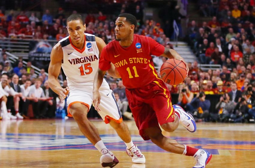 Mar 25, 2016; Chicago, IL, USA; Iowa State Cyclones guard Monte Morris (11) is defended by Virginia Cavaliers guard Malcolm Brogdonn during the first half in a semifinal game in the Midwest regional of the NCAA Tournament at United Center. Mandatory Credit: Dennis Wierzbicki-USA TODAY Sports