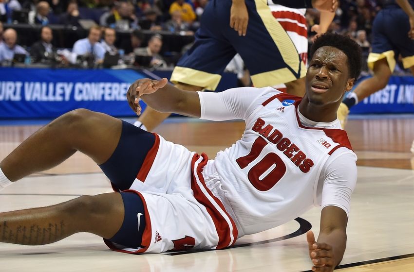 Mar 18, 2016; St. Louis, MO, USA; Wisconsin Badgers forward Nigel Hayes (10) reacts on the floor during the first half of the game in the first round against the Pittsburgh Panthers in the 2016 NCAA Tournament at Scottrade Center. Mandatory Credit: Jasen Vinlove-USA TODAY Sports