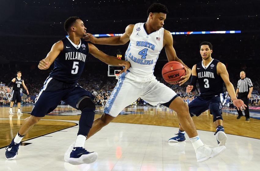 Apr 4, 2016; Houston, TX, USA; Villanova Wildcats guard Phil Booth (5) goes after a loose ball against North Carolina Tar Heels forward Brice Johnson (11) and North Carolina Tar Heels forward Isaiah Hicks (4) during the second half in the championship game of the 2016 NCAA Men's Final Four at NRG Stadium. Mandatory Credit: Bob Donnan-USA TODAY Sports