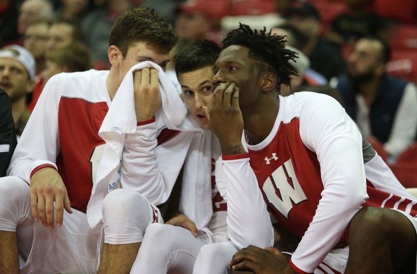 Nov 11, 2016; Madison, WI, USA; Wisconsin Badgers forward Nigel Hayes (right) chats with teammates Bronson Koenig, center, and Ethan Happ while sitting on the bench during the game with the Central Arkansas Bears at the Kohl Center. Wisconsin defeated Central Arkansas 79-47. Mandatory Credit: Mary Langenfeld-USA TODAY Sports