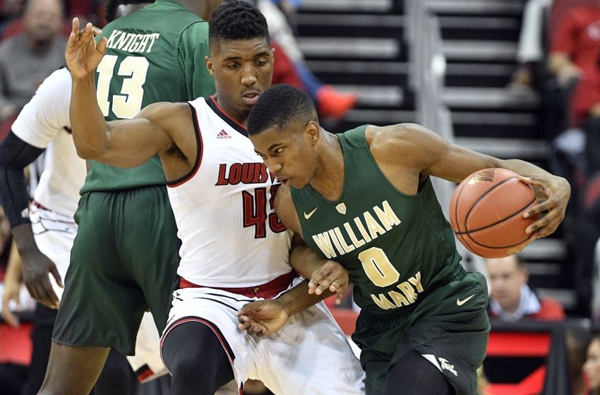Nov 14, 2016; Louisville, KY, USA; William & Mary Tribe guard Daniel Dixon (0) dribbles against Louisville Cardinals guard Donovan Mitchell (45) during the first half at KFC Yum! Center. Mandatory Credit: Jamie Rhodes-USA TODAY Sports