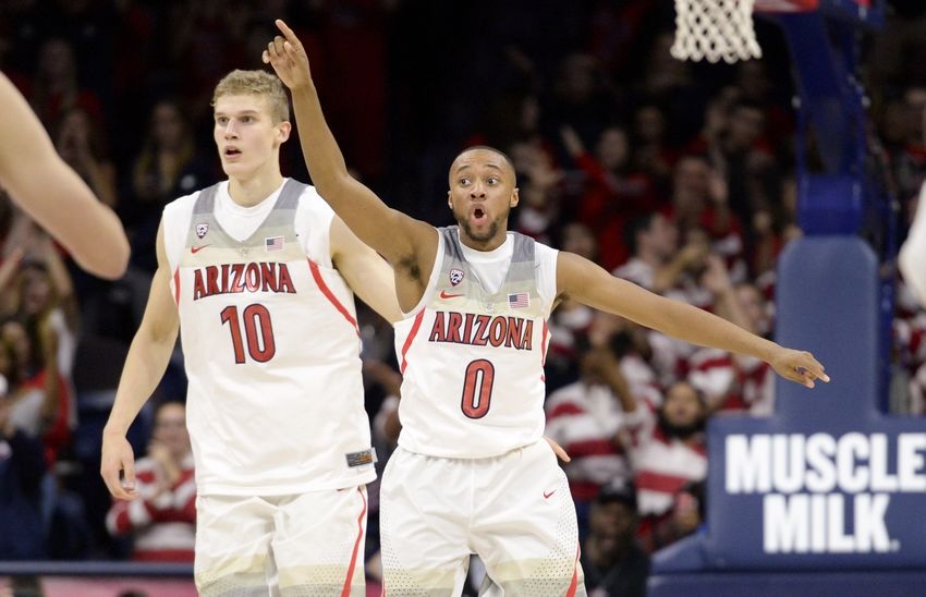 Nov 18, 2016; Tucson, AZ, USA; Arizona Wildcats forward Lauri Markkanen (10) and Arizona Wildcats guard Parker Jackson-Cartwright (0) celebrate after scoring against the Sacred Heart Pioneers during the second half at McKale Center. Arizona won 95-65. Mandatory Credit: Casey Sapio-USA TODAY Sports