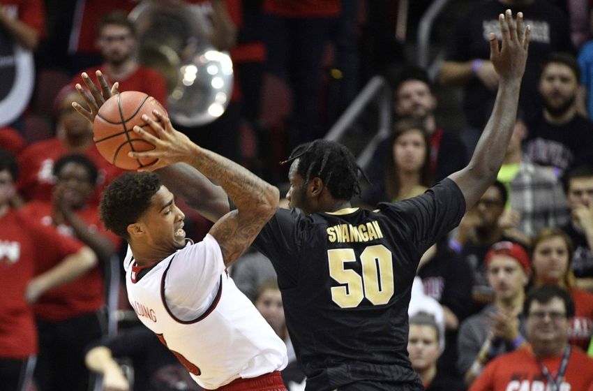 Nov 30, 2016; Louisville, KY, USA; Louisville Cardinals forward Ray Spalding (13) battles Purdue Boilermakers forward Caleb Swanigan (50) for a rebound during the second half at KFC Yum! Center. Louisville defeated Purdue 71-64. Mandatory Credit: Jamie Rhodes-USA TODAY Sports