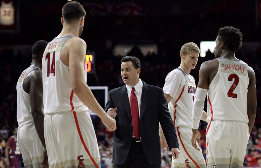 Nov 30, 2016; Tucson, AZ, USA; Arizona Wildcats head coach Sean Miller (C) talks to center Dusan Ristic (14) forward Lauri Markkanen (10) and guard Kobi Simmons (2) during the first half against the Texas Southern Tigers at McKale Center. Arizona won 85-63. Mandatory Credit: Casey Sapio-USA TODAY Sports