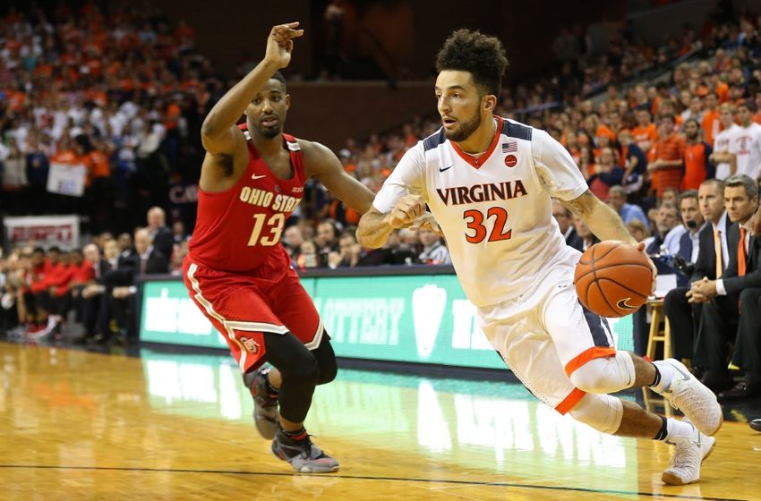 Nov 30, 2016; Charlottesville, VA, USA; Virginia Cavaliers guard London Perrantes (32) dribbles the ball past Ohio State Buckeyes guard JaQuan Lyle (13) in the second half at John Paul Jones Arena. The Cavaliers won 63-61. Mandatory Credit: Geoff Burke-USA TODAY Sports