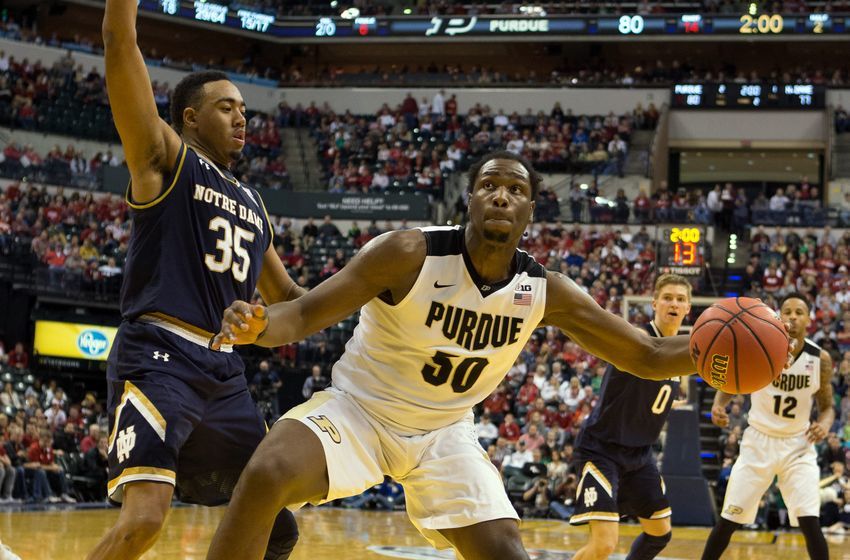 Dec 17, 2016; Indianapolis, IN, USA; Purdue Boilermakers forward Caleb Swanigan (50) dribbles the ball while Notre Dame Fighting Irish forward Bonzie Colson (35) defends in the second half of the game at Bankers Life Fieldhouse. The Purdue Boilermakers beat Notre Dame Fighting Irish 86-81. Mandatory Credit: Trevor Ruszkowski-USA TODAY Sports
