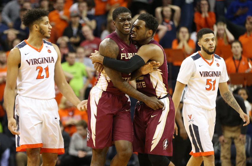 Dec 31, 2016; Charlottesville, VA, USA; Florida State Seminoles guard Dwayne Bacon (4) celebrates with Seminoles guard Xavier Rathan-Mayes (22) after making the game winning three point field goal as Virginia Cavaliers forward Isaiah Wilkins (21) and Cavaliers guard Darius Thompson (51) look on with two seconds left in the second half at John Paul Jones Arena. The Seminoles won 60-58. Mandatory Credit: Geoff Burke-USA TODAY Sports