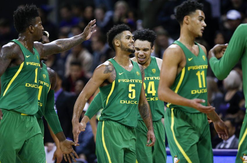 Jan 4, 2017; Seattle, WA, USA; Oregon Ducks guard Tyler Dorsey (5) is greeted by forward Dillon Brooks (24) and forward Jordan Bell (1) during a second half timeout at Alaska Airlines Arena at Hec Edmundson Pavilion. Oregon defeated Washington, 83-61. Mandatory Credit: Joe Nicholson-USA TODAY Sports