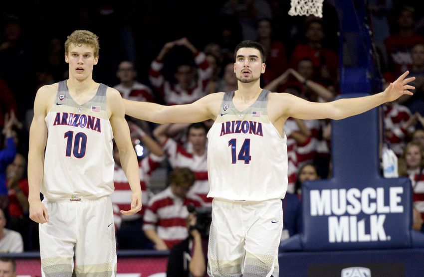 Jan 5, 2017; Tucson, AZ, USA; Arizona Wildcats forward Lauri Markkanen (10) and center Dusan Ristic (14) celebrate after scoring against the Utah Utes during the second half at McKale Center. Arizona won 66-56. Mandatory Credit: Casey Sapio-USA TODAY Sports