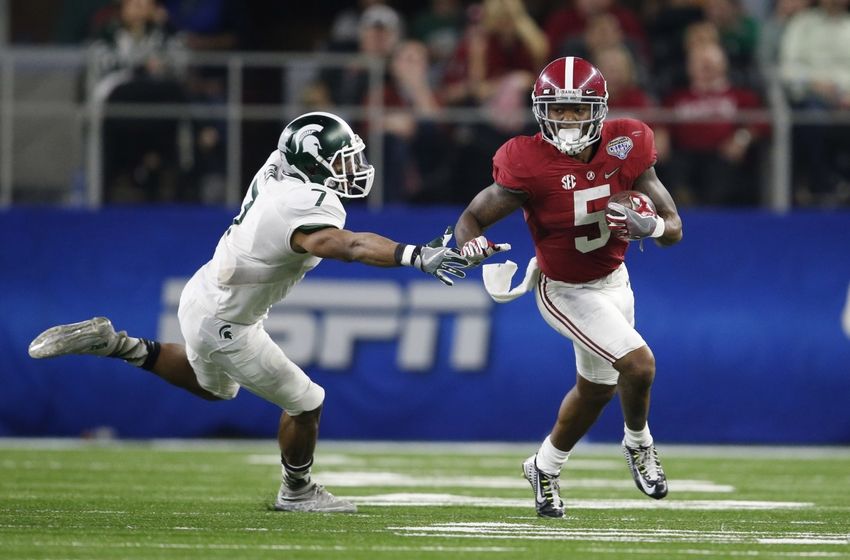 Dec 31, 2015; Arlington, TX, USA; Alabama Crimson Tide cornerback Cyrus Jones (5) returns a punt in the 2015 CFP semifinal at the Cotton Bowl against Michigan State Spartans cornerback Demetrious Cox (7) at AT&T Stadium. Mandatory Credit: Matthew Emmons-USA TODAY Sports