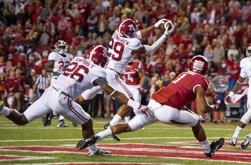 Oct 8, 2016; Fayetteville, AR, USA; Alabama Crimson Tide defensive back Minkah Fitzpatrick (29) intercepts the ball intended for Arkansas Razorbacks wide receiver Jared Cornelius (1) during the fourth quarter at Donald W. Reynolds Razorback Stadium. Mandatory Credit: Brett Rojo-USA TODAY Sports