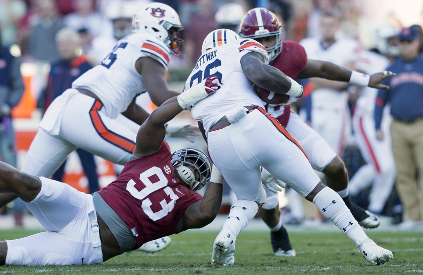 Nov 26, 2016; Tuscaloosa, AL, USA; Alabama Crimson Tide defensive lineman Jonathan Allen (93) grabs Auburn Tigers running back Kamryn Pettway (36) at Bryant-Denny Stadium. Mandatory Credit: Marvin Gentry-USA TODAY Sports