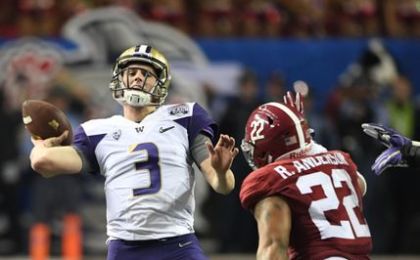 Dec 31, 2016; Atlanta, GA, USA; Washington Huskies quarterback Jake Browning (3) throws an interception as Alabama Crimson Tide linebacker Ryan Anderson (22) pressures during the fourth quarter of the 2016 CFP semifinal at the Peach Bowl at the Georgia Dome. Alabama won 24-7. Mandatory Credit: John David Mercer-USA TODAY Sports