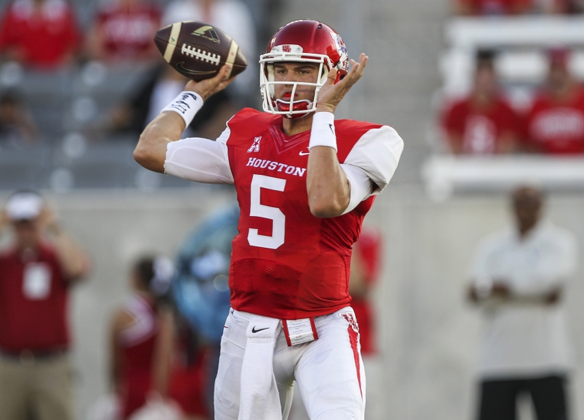 Oct 2, 2014; Houston, TX, USA; Houston Cougars quarterback John O'Korn (5) attempts a pass during the first quarter against the Central Florida Knights at TDECU Stadium. Mandatory Credit: Troy Taormina-USA TODAY Sports