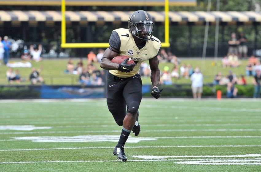 Sep 19, 2015; Nashville, TN, USA; Vanderbilt Commodores running back Ralph Webb (7) rushes for a touchdown against the Austin Peay Governors during the first half at Vanderbilt Stadium. Mandatory Credit: Jim Brown-USA TODAY Sports