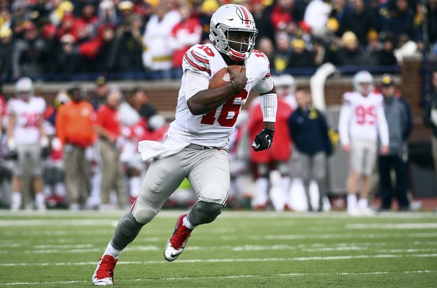 Nov 28, 2015; Ann Arbor, MI, USA; Ohio State Buckeyes quarterback J.T. Barrett (16) runs the ball in the third quarter against the Michigan Wolverines at Michigan Stadium. Mandatory Credit: Tim Fuller-USA TODAY Sports