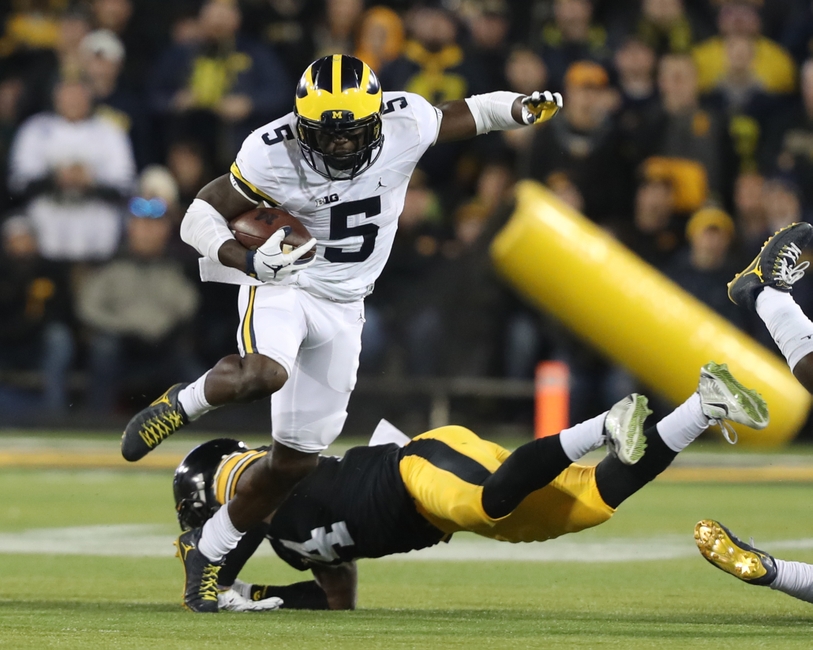 Nov 12, 2016; Iowa City, IA, USA; Michigan Wolverines linebacker Jabrill Peppers (5) carries the ball as Iowa Hawkeyes defensive back Desmond King (14) defends during the first half at Kinnick Stadium. Mandatory Credit: Reese Strickland-USA TODAY Sports