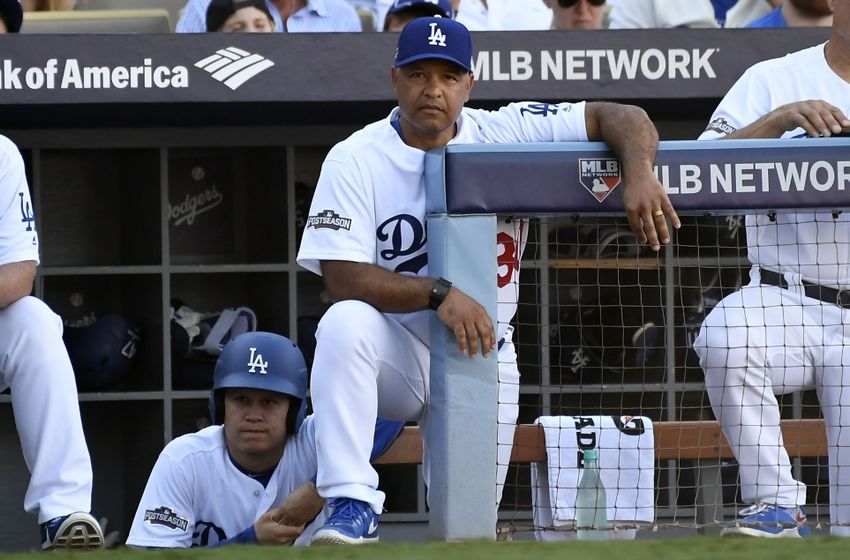 Oct 10, 2016; Los Angeles, CA, USA; Los Angeles Dodgers manager Dave Roberts (30) in the dugout during the sixth inning against the Washington Nationals in game three of the 2016 NLDS playoff baseball series at Dodger Stadium. Mandatory Credit: Richard Mackson-USA TODAY Sports