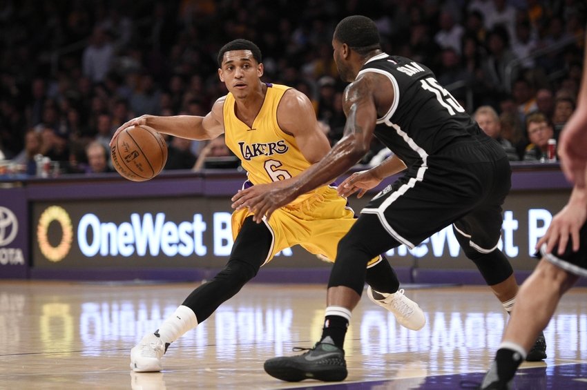 Mar 1, 2016; Los Angeles, CA, USA; Los Angeles Lakers guard Jordan Clarkson (6) handles the ball as Brooklyn Nets guard Donald Sloan (right) defends during the first quarter at Staples Center. Mandatory Credit: Kelvin Kuo-USA TODAY Sports