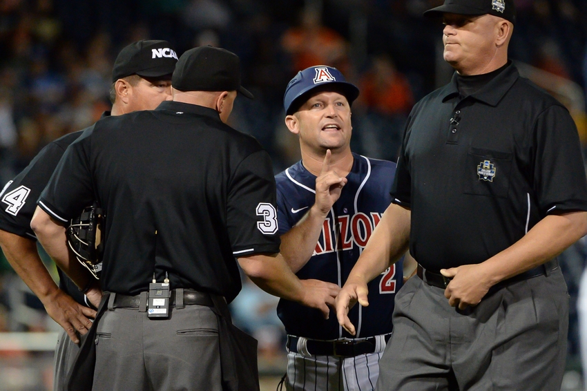 Jun 20, 2016; Omaha, NE, USA; Arizona Wildcats head coach Jay Johnson (2) argues a point with the umpires in the ninth inning in the game against the Oklahoma State Cowboys in the 2016 College World Series at TD Ameritrade Park. Oklahoma State defeated Arizona 1-0. Mandatory Credit: Steven Branscombe-USA TODAY Sports