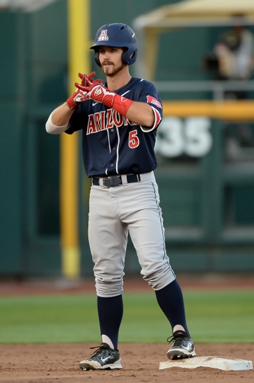 Jun 18, 2016; Omaha, NE, USA; Arizona Wildcats infielder Louis Boyd (5) signals to the bench after hitting a double in the fifth inning against the Miami Hurricanes in the 2016 College World Series at TD Ameritrade Park. Arizona defeated Miami 5-1. Mandatory Credit: Steven Branscombe-USA TODAY Sports